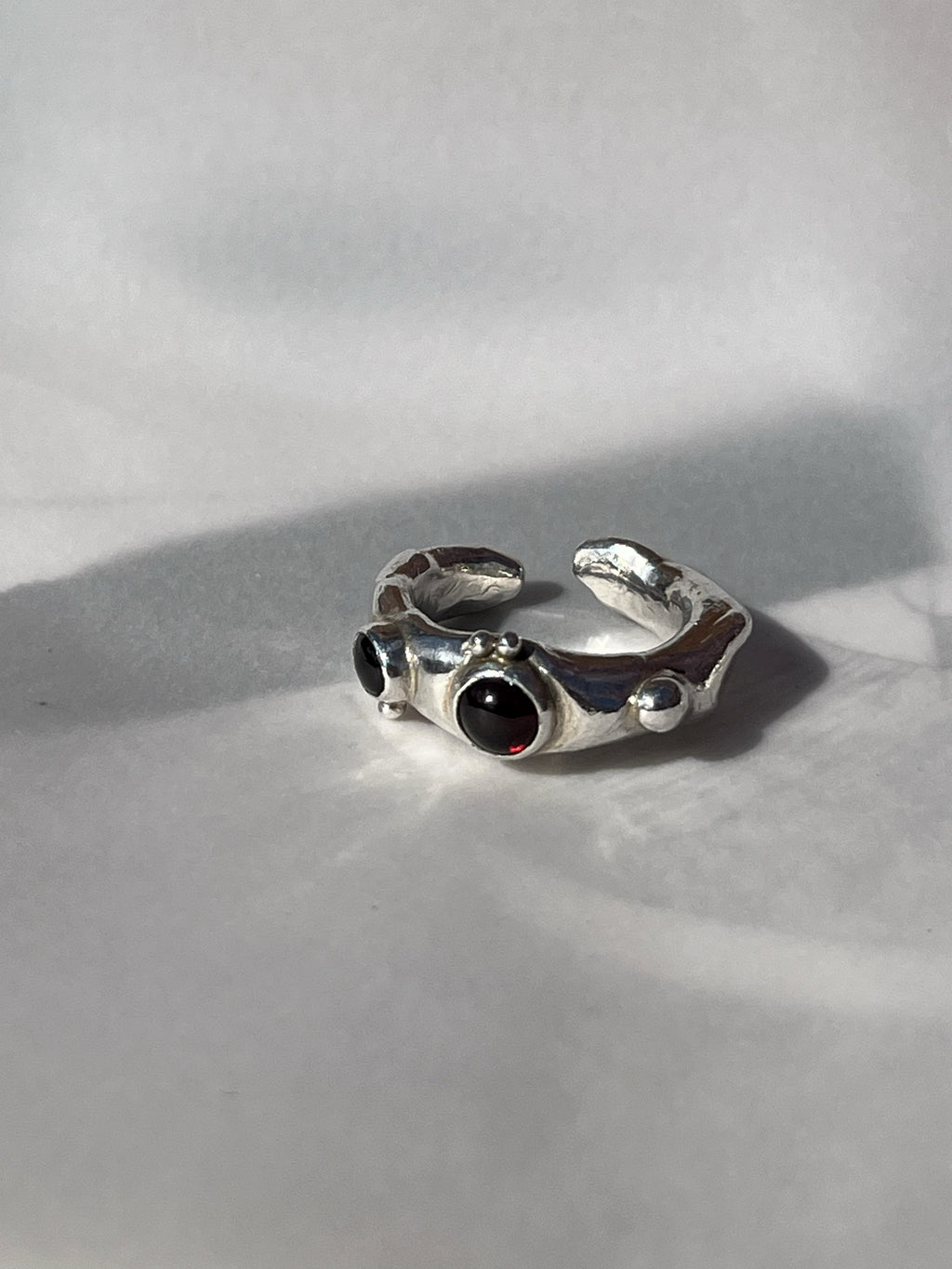 MOLTEN RING WITH GARNET & BLACKSTAR