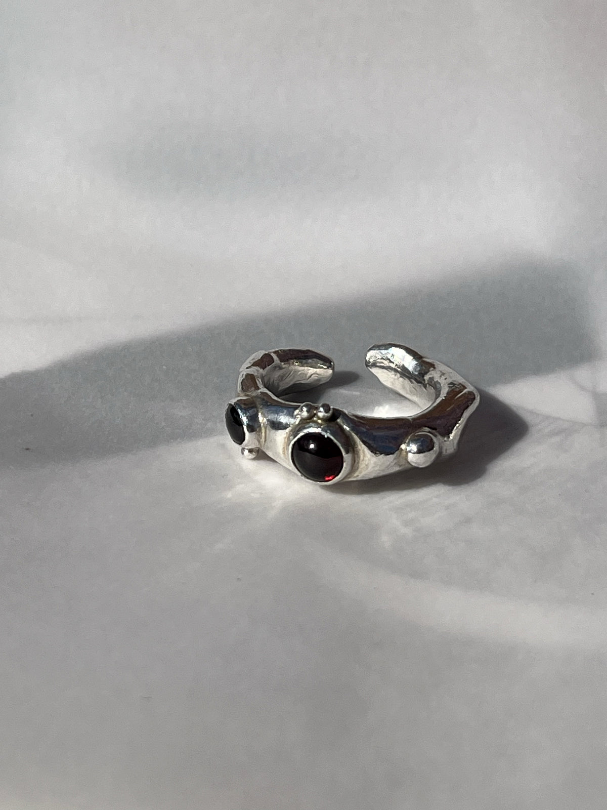 MOLTEN RING WITH GARNET & BLACKSTAR